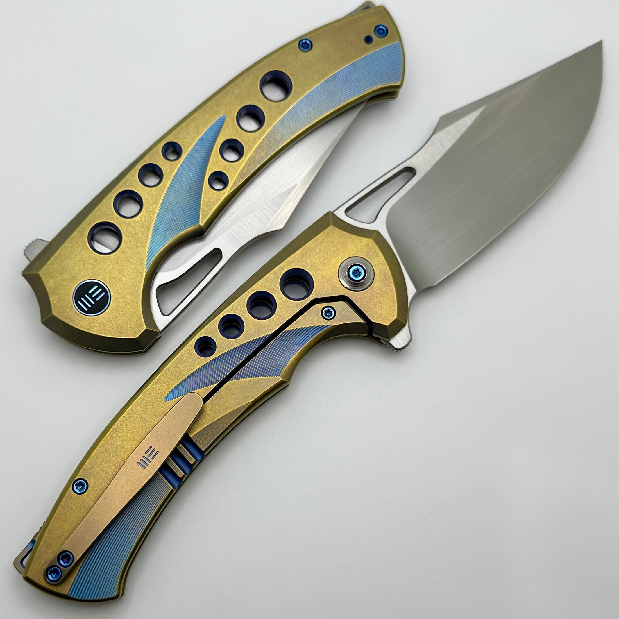 Premium WE Knife Swiftfin: Golden/Blue Titanium Handles with Blue Holes & Hand Satin 20CV Blade WE23051-4