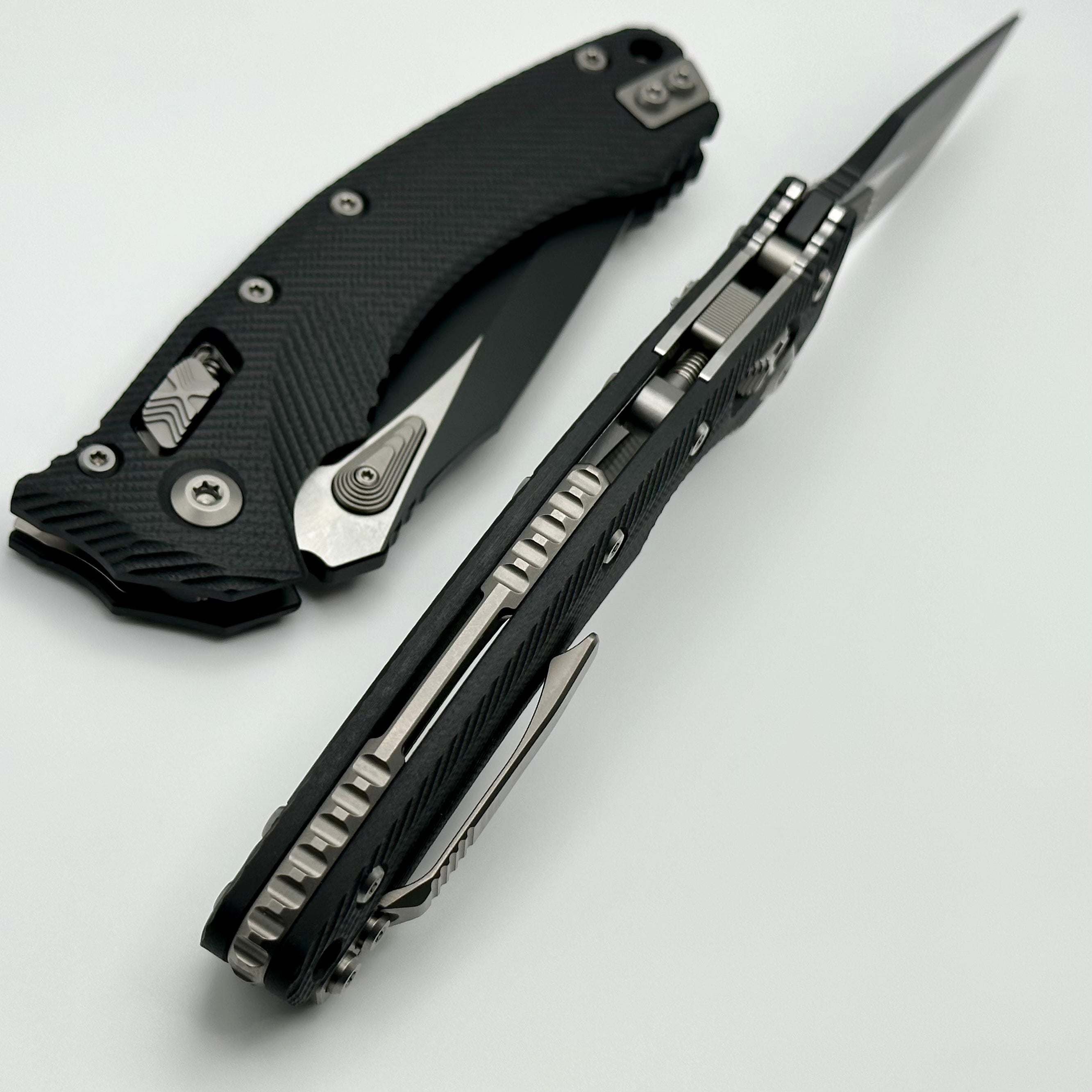 Microtech Amphibian RAM LOK Premium Tactical Knife - Black Fluted G-10 & M390MK Blade