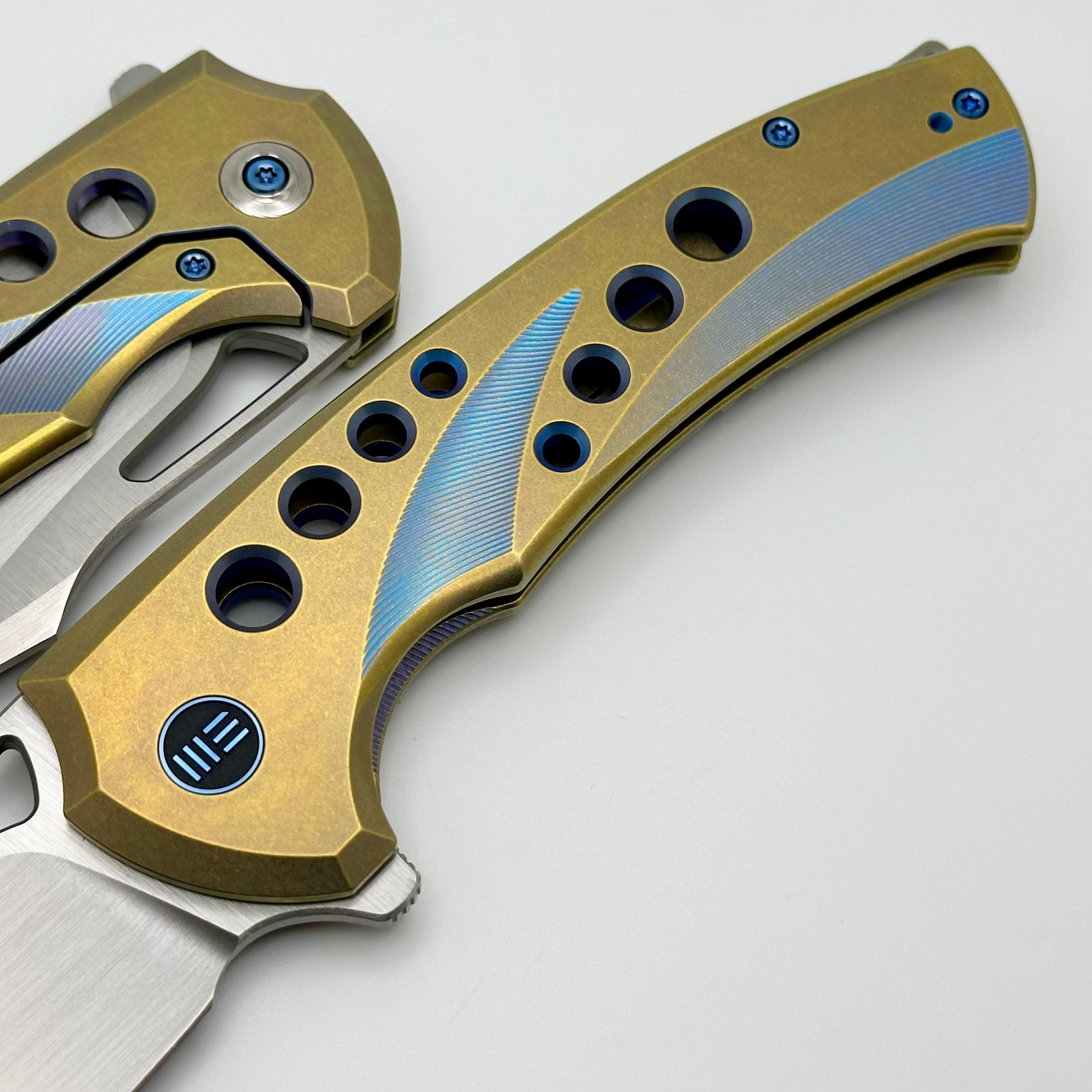 Premium WE Knife Swiftfin: Golden/Blue Titanium Handles with Blue Holes & Hand Satin 20CV Blade WE23051-4