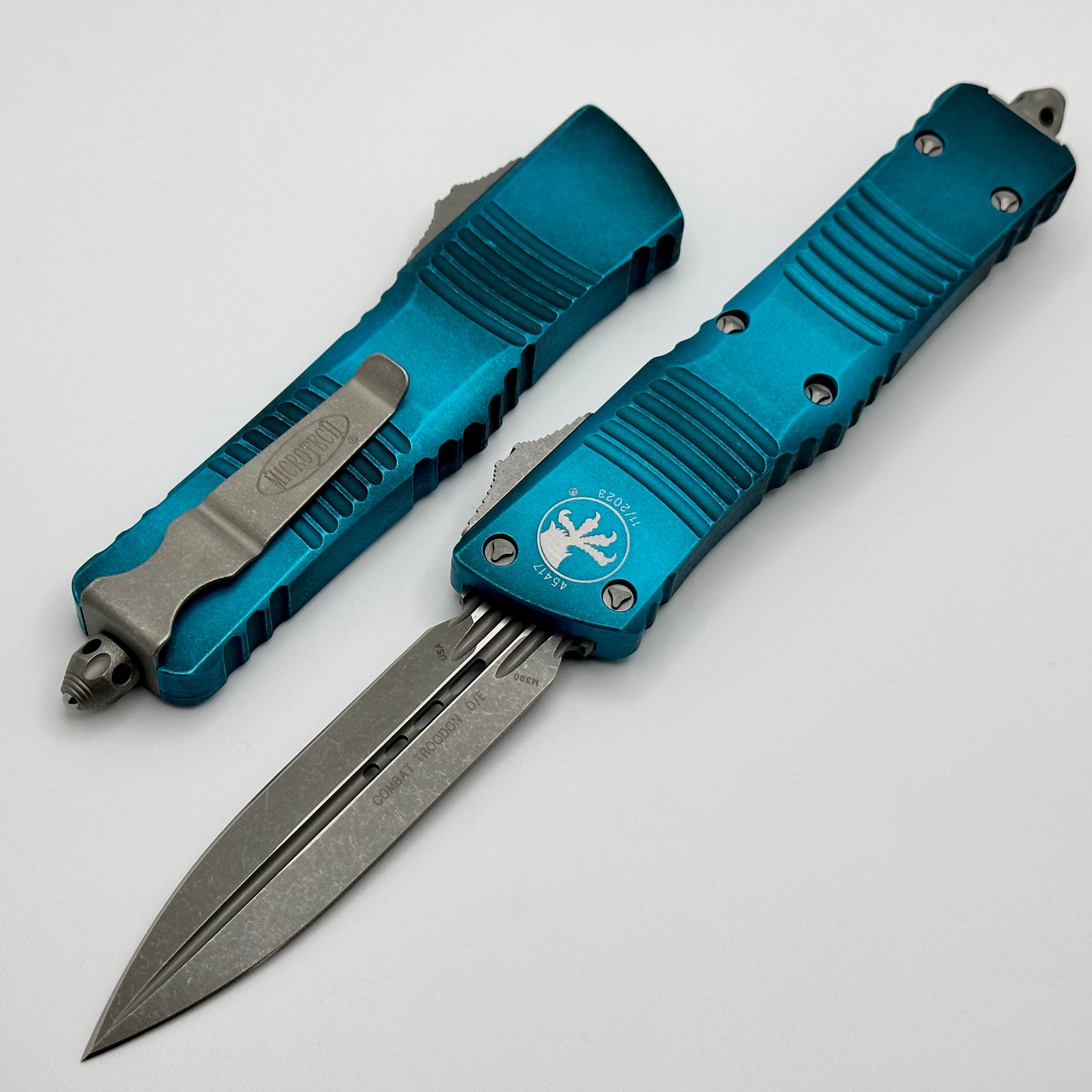 Microtech Combat Troodon Premium Automatic Knife - Weathered Turquoise, Fluted Double Edge, Apocalyptic Finish