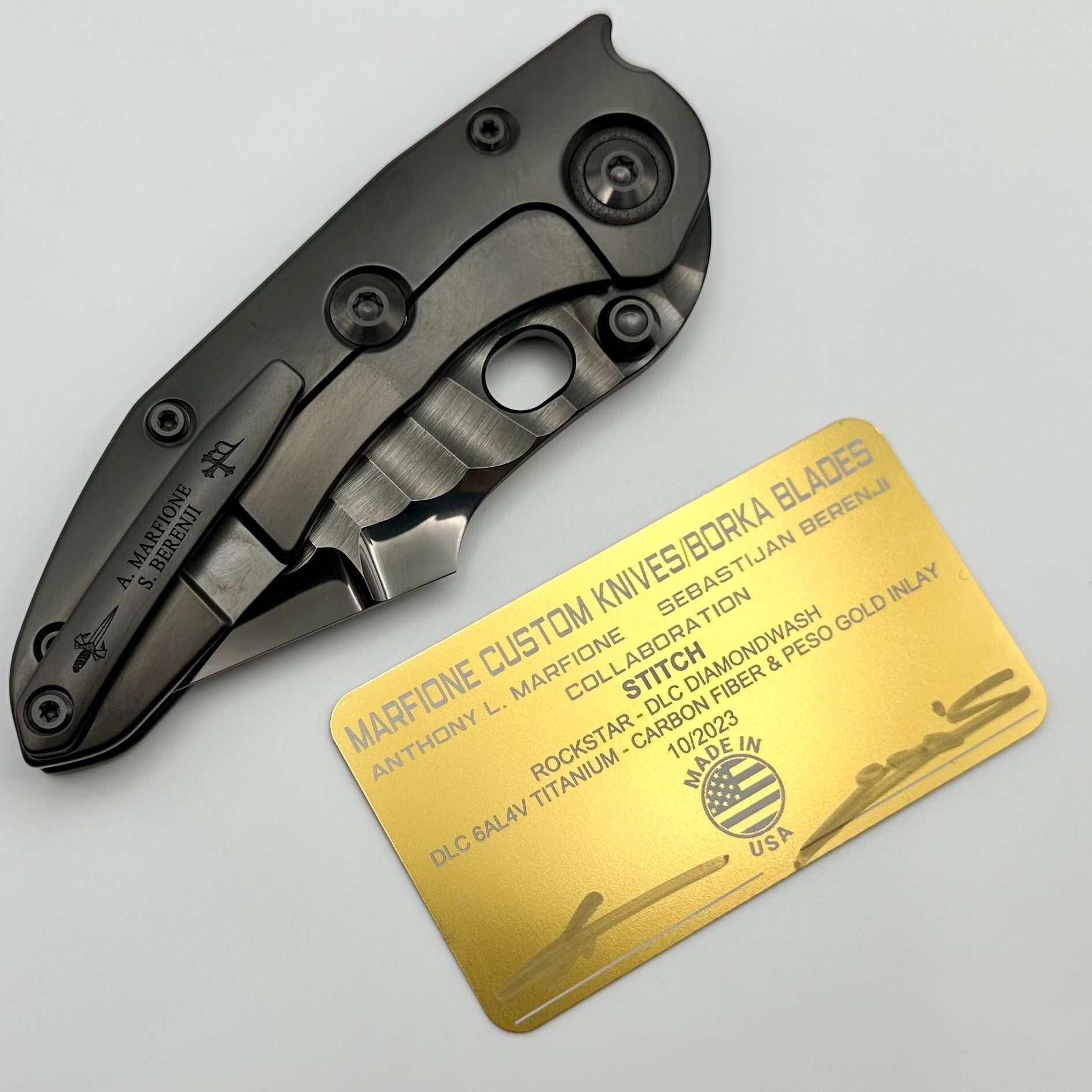Premium Marfione Custom Knives & Borka Blades Darkstar Stitch - Diamond Wash & Rocked Double Star Grind M390, Two Tone Satin/DLC, Peso Gold Carbon Fiber Inlaid Titanium (Pre-Owned)