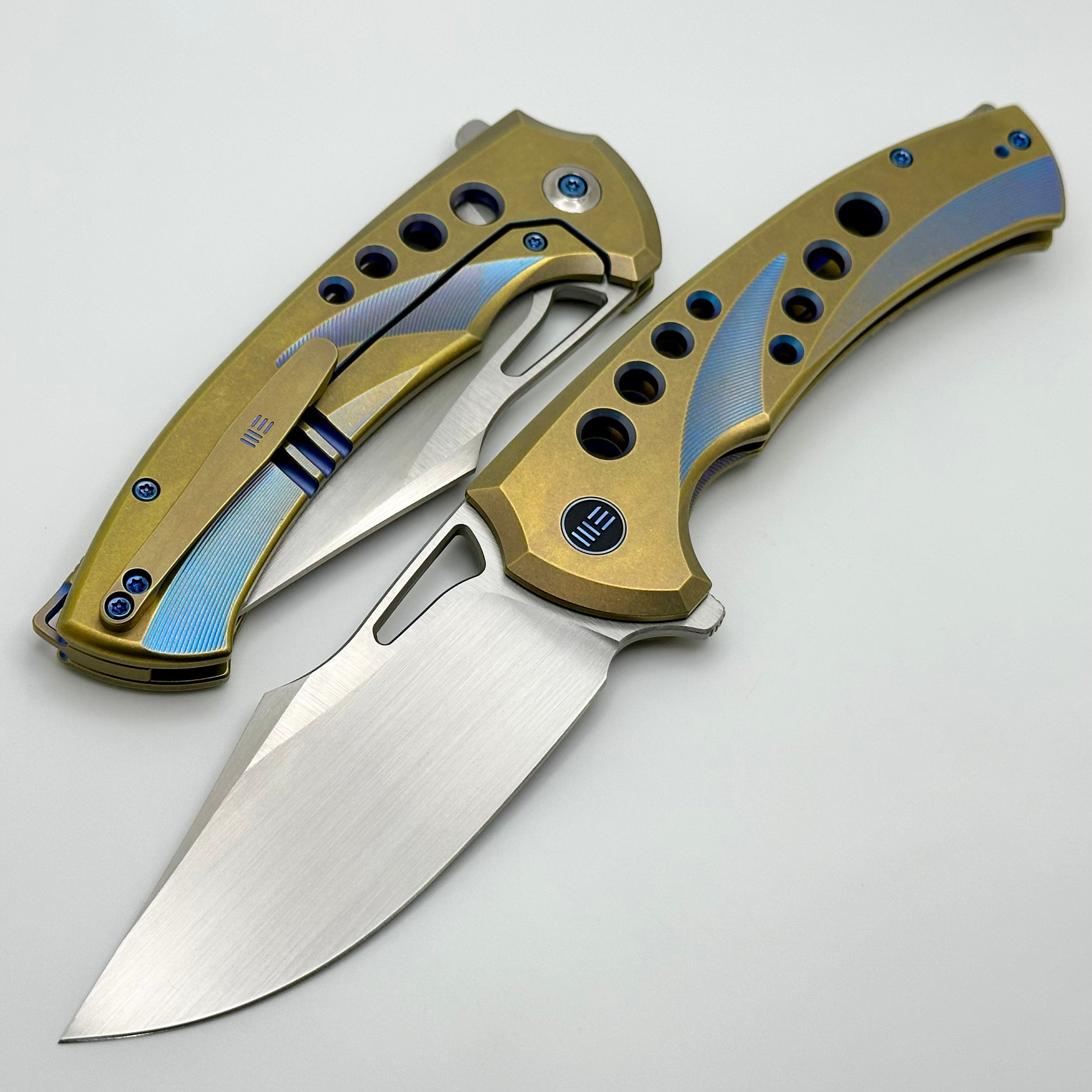 Premium WE Knife Swiftfin: Golden/Blue Titanium Handles with Blue Holes & Hand Satin 20CV Blade WE23051-4