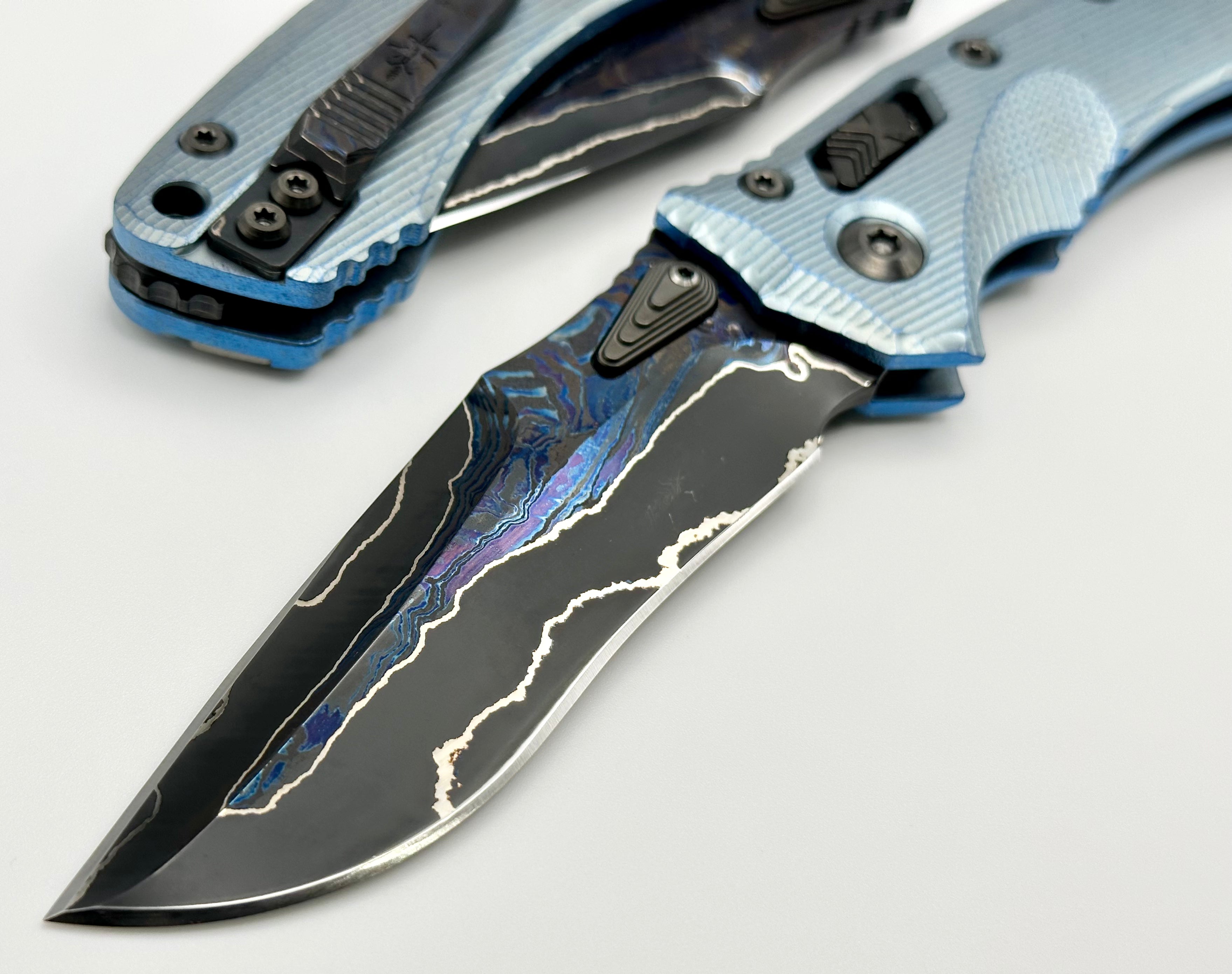 Premium Marfione Custom Knives Amphibian RAM-LOK: Limited Edition Broken Anvil Damascus & Fluted Ice Blue Titanium