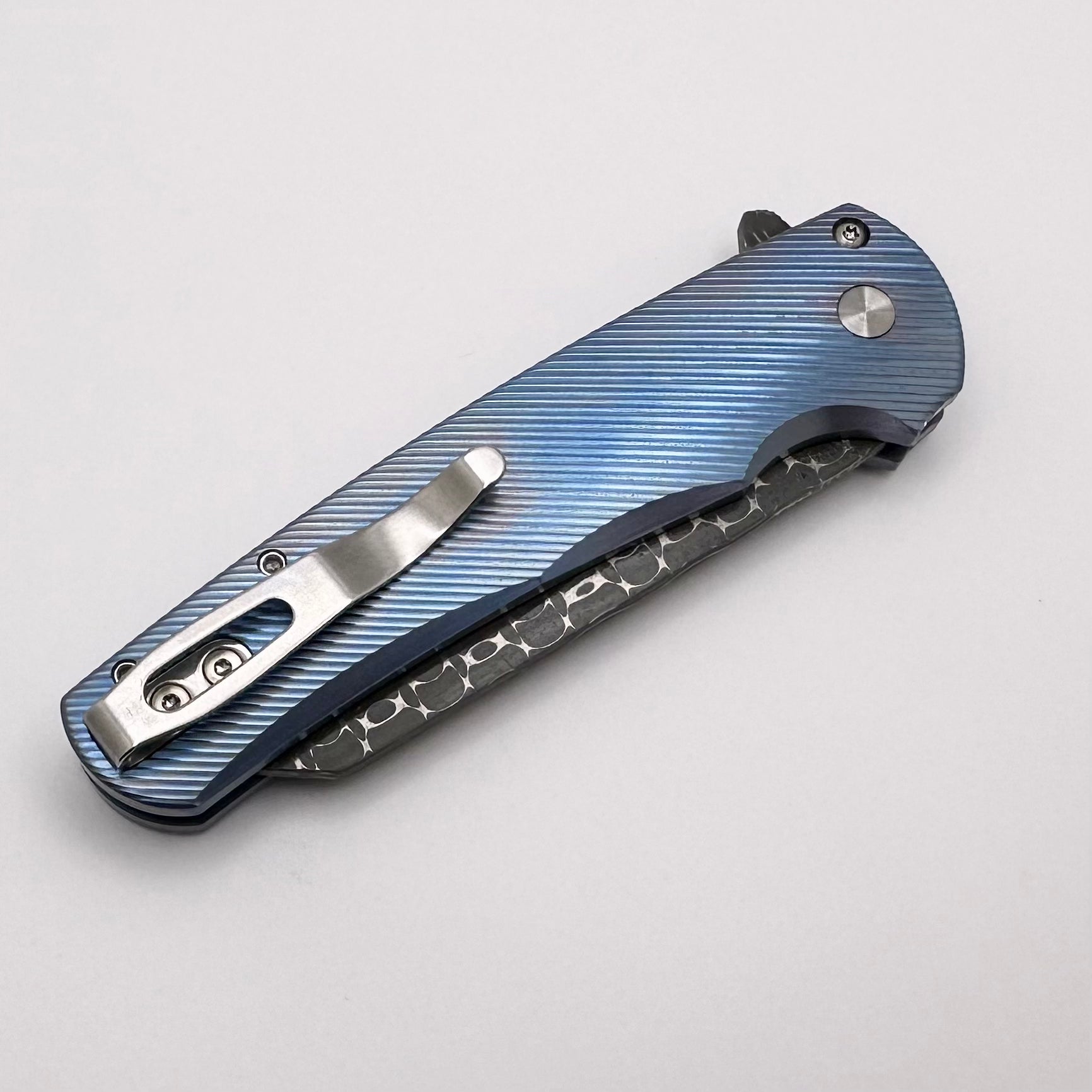 Ultimate Pro-Tech Malibu: Blue Titanium Handle with Pearl Button & Vegas Forge Razorwire Damascus Reverse Tanto Blade