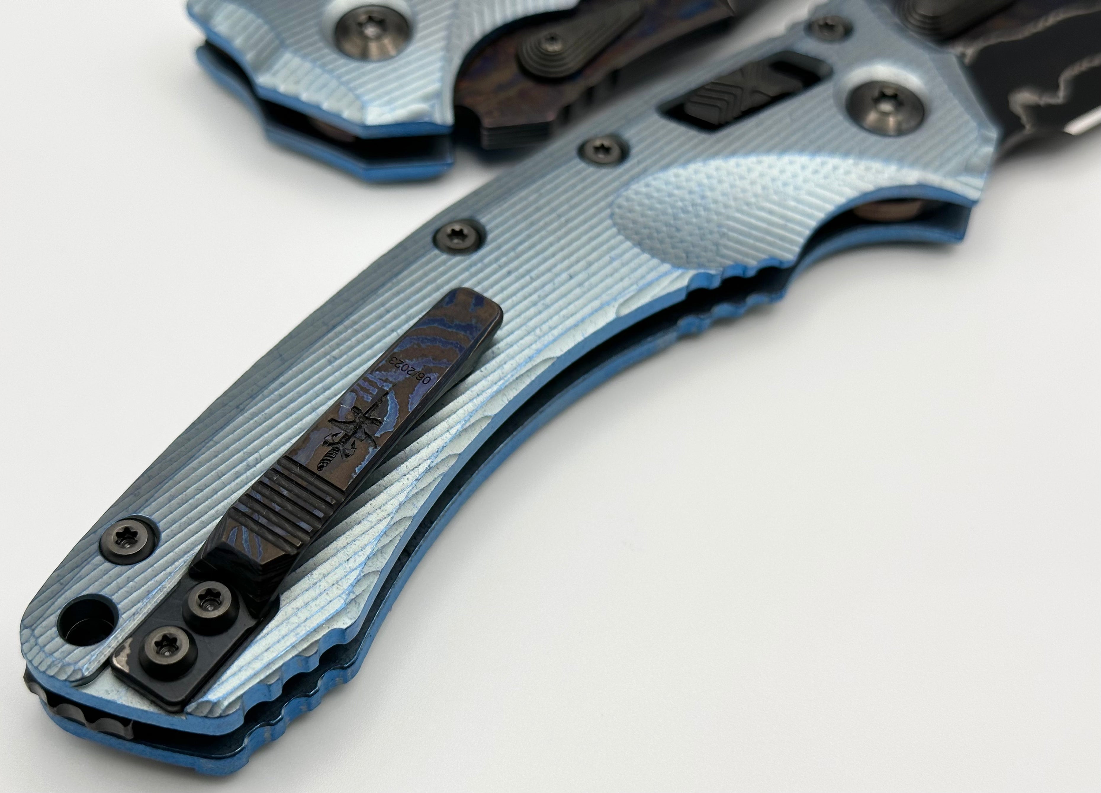 Premium Marfione Custom Knives Amphibian RAM-LOK: Limited Edition Broken Anvil Damascus & Fluted Ice Blue Titanium