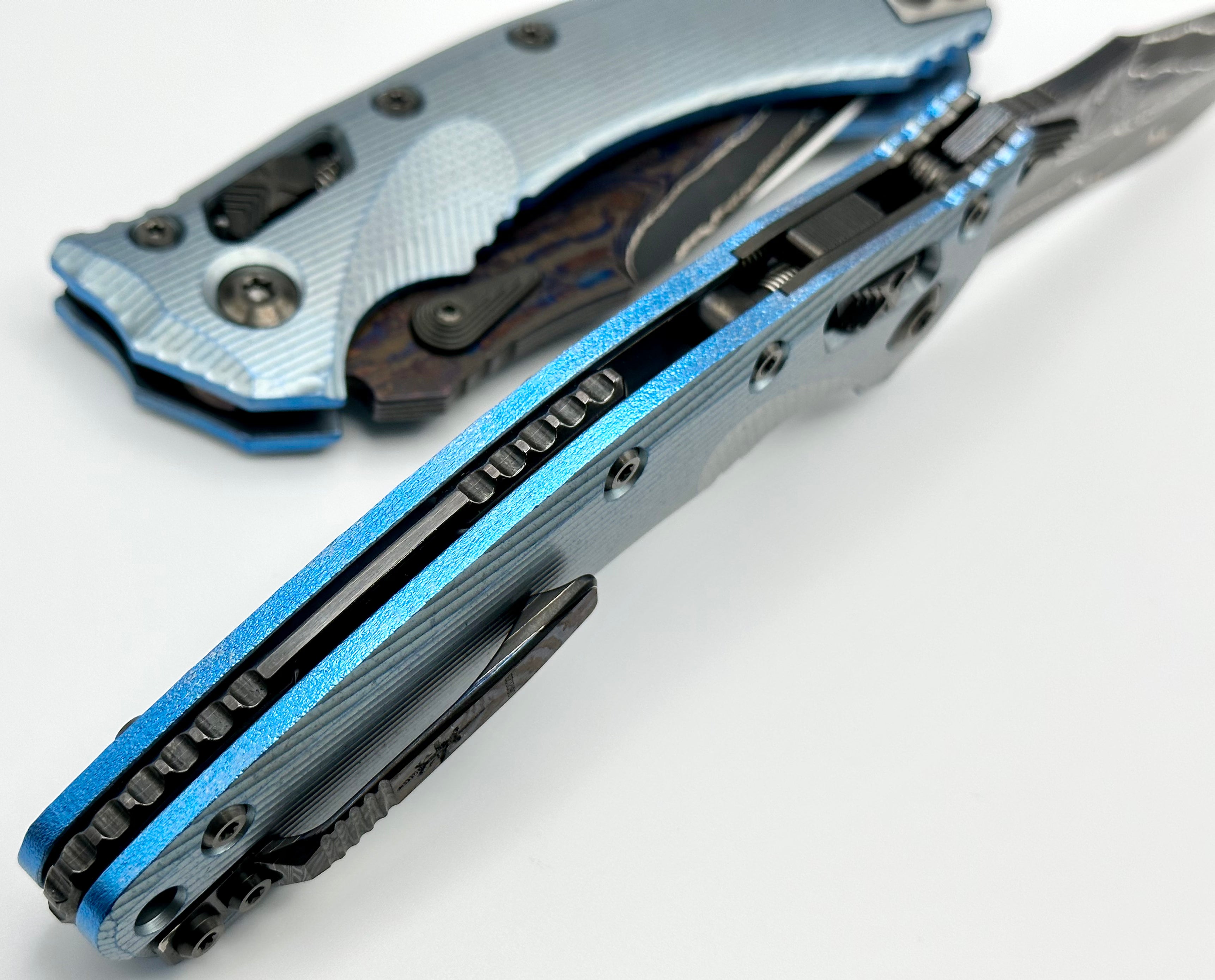 Premium Marfione Custom Knives Amphibian RAM-LOK: Limited Edition Broken Anvil Damascus & Fluted Ice Blue Titanium