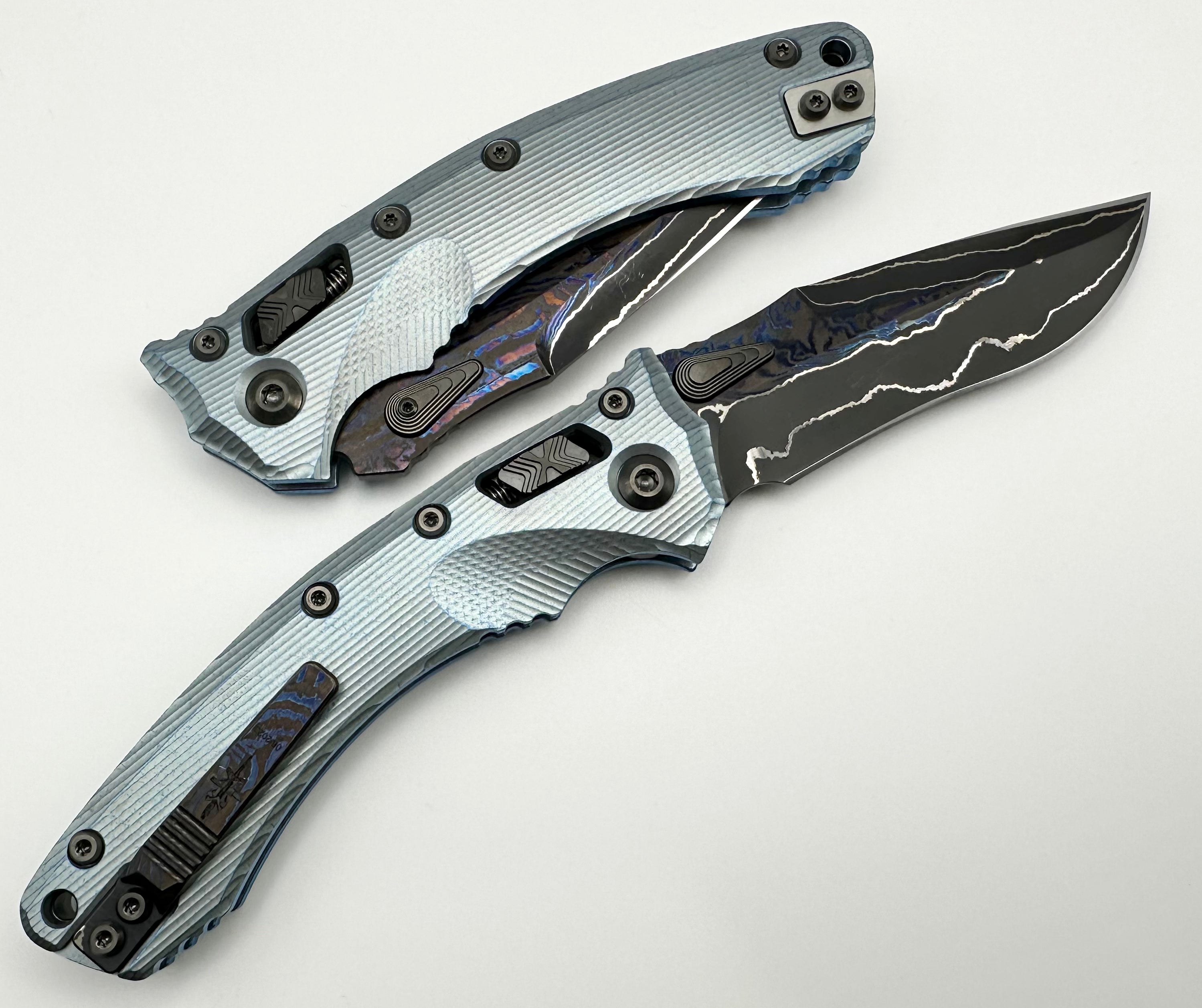 Premium Marfione Custom Knives Amphibian RAM-LOK: Limited Edition Broken Anvil Damascus & Fluted Ice Blue Titanium