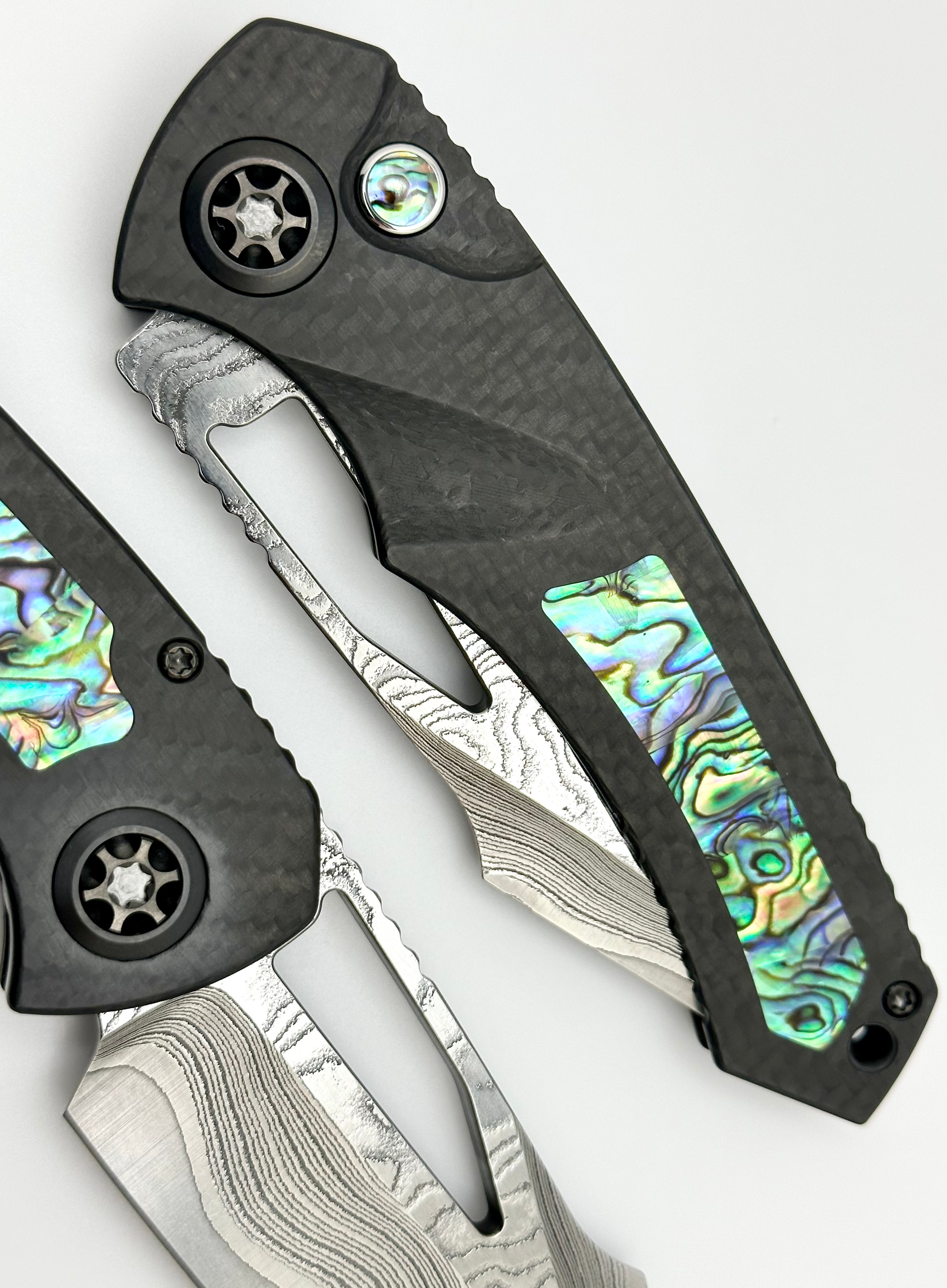 Heretic Knives Pariah Custom Button Lock - Premium Carbon Fiber & Abalone Inlay with Vegas Forge Wood Grain San Mai Damascus